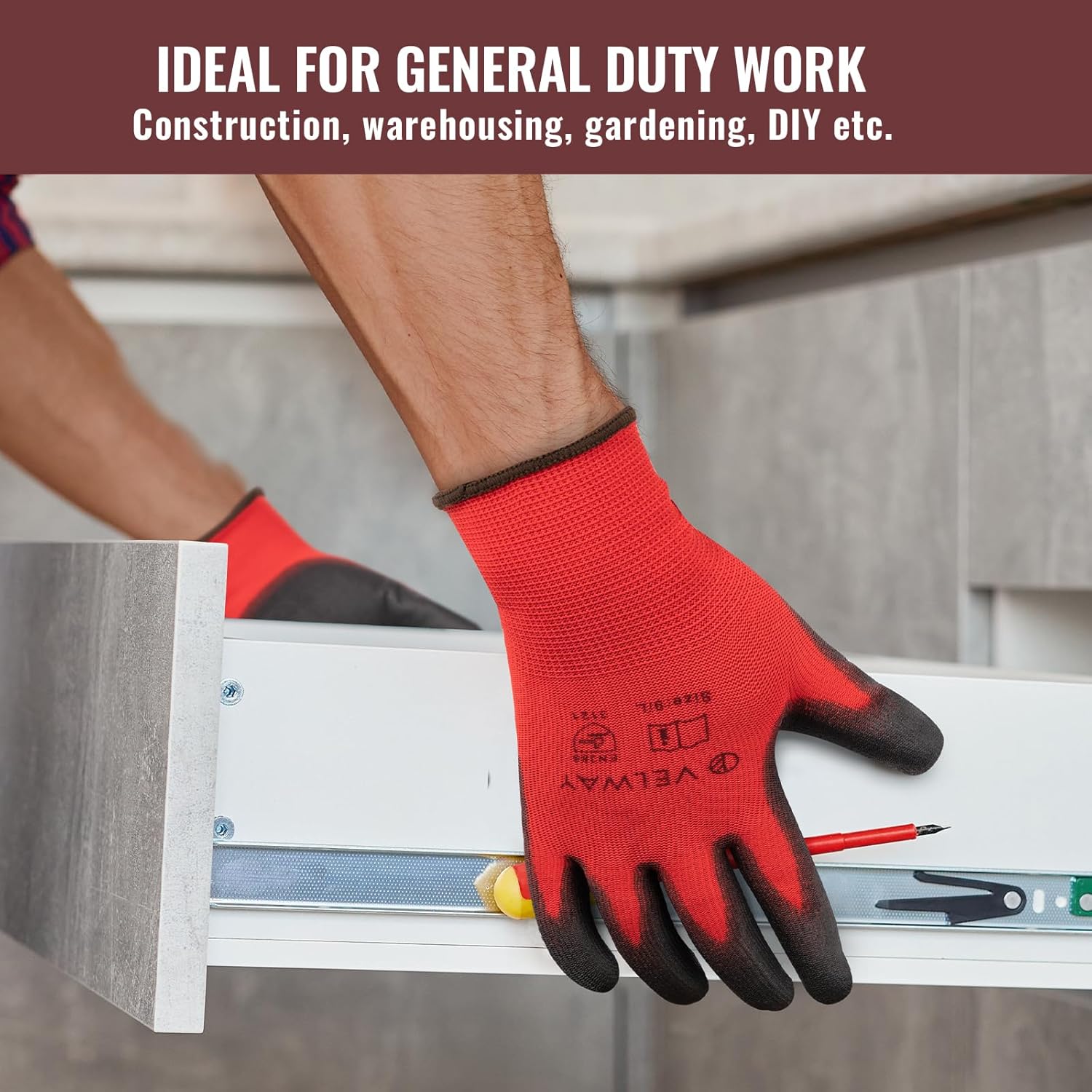 Red and black work gloves being used on a construction site with text about general duty work.