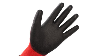 Black glove with red cuff on a white background