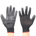 Pair of black gloves with textured palm on a white background